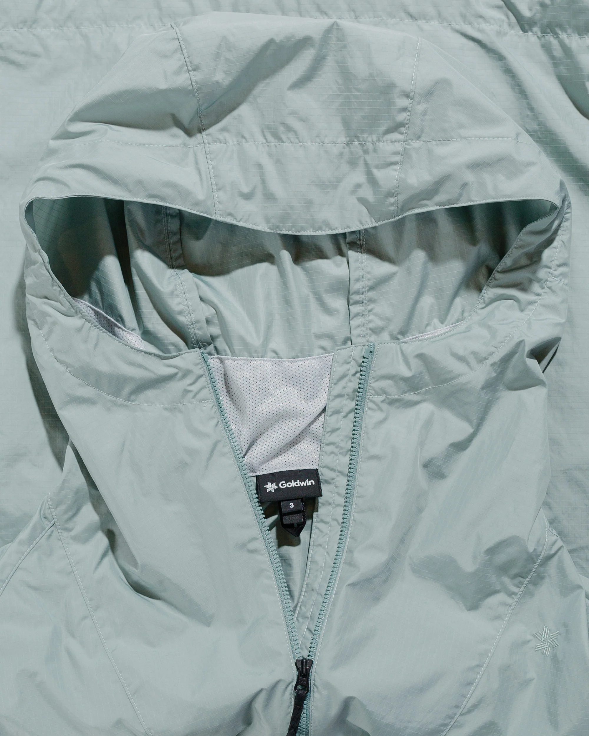 Goldwin Rip-stop Hooded Jacket Mist Green - Image 5